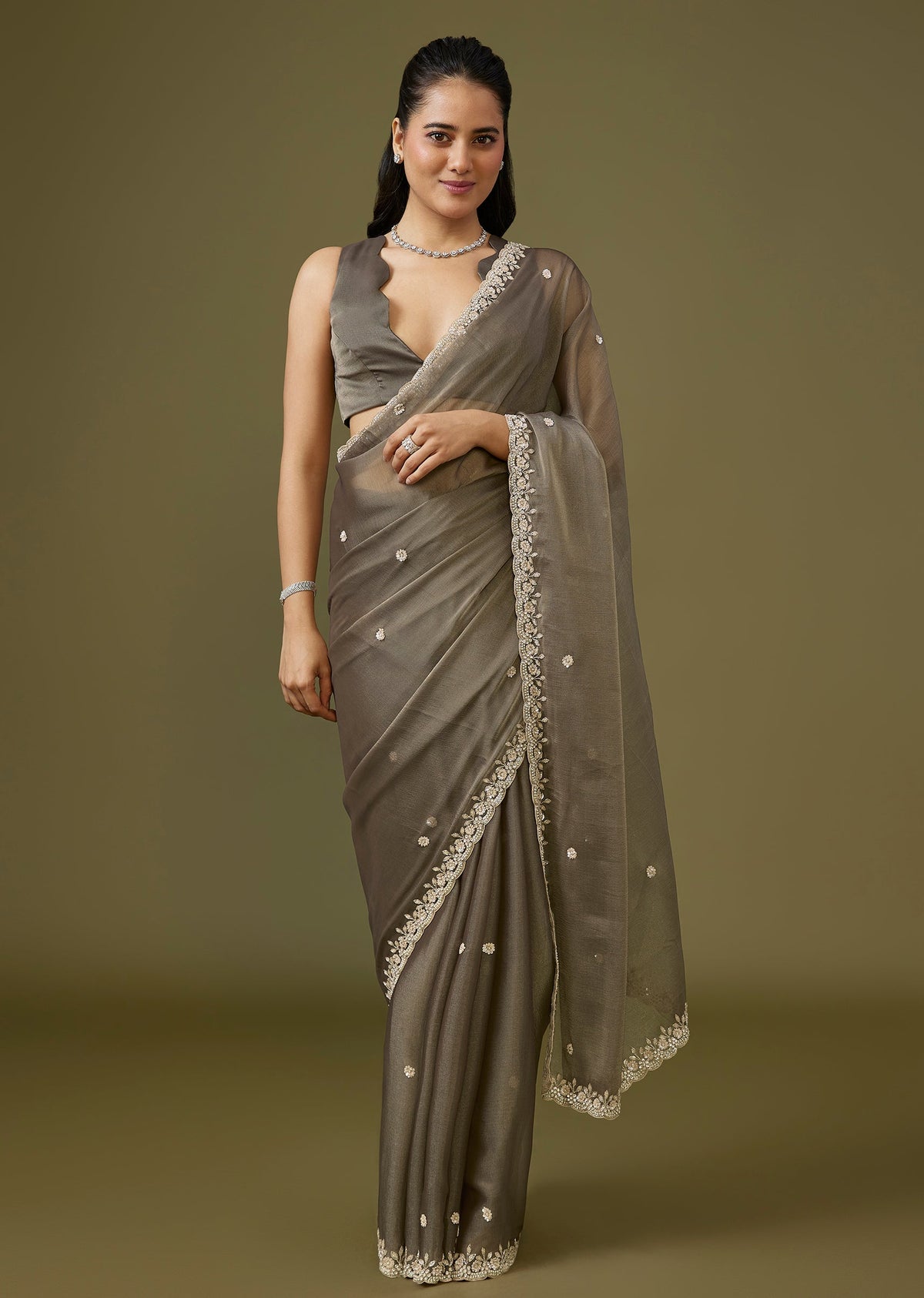 Grey Tissue Saree With Floral Border And Buttis