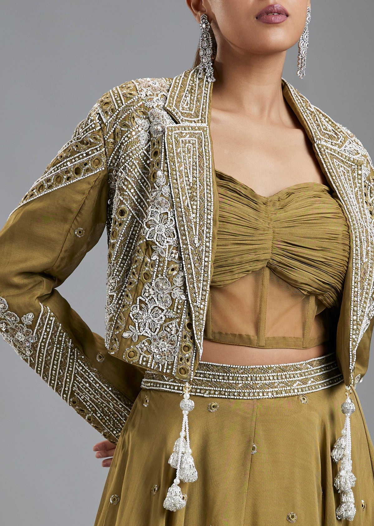 Green Organza Lehenga Set With Pleated Bustier And Embellished Jacket