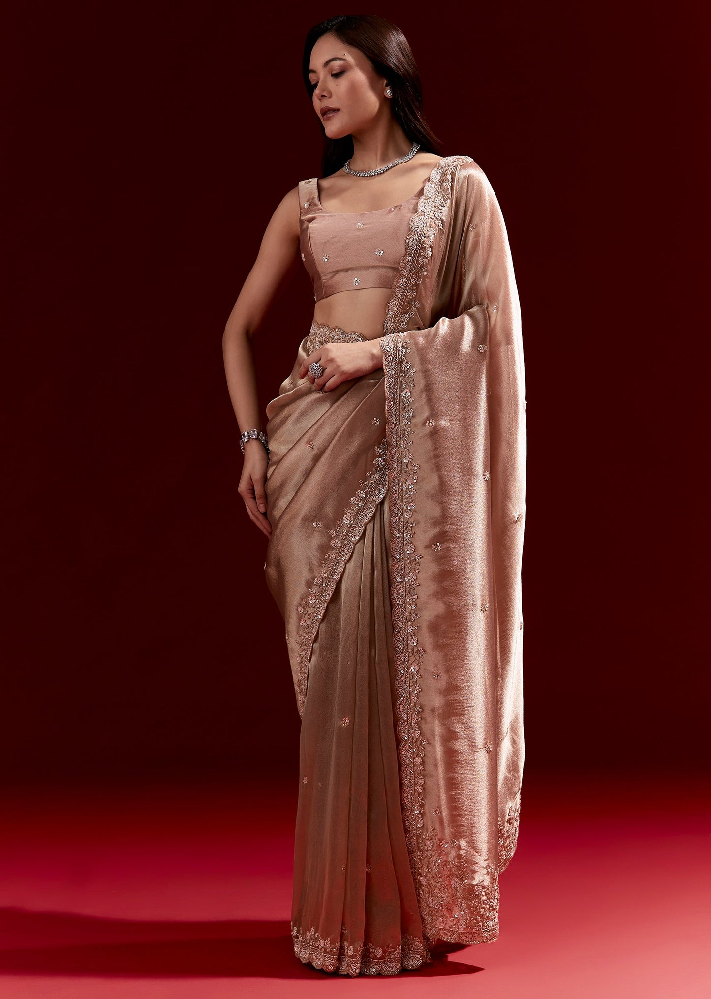 Peach Tissue Saree With Scalloped Embroidered Border And Buttis