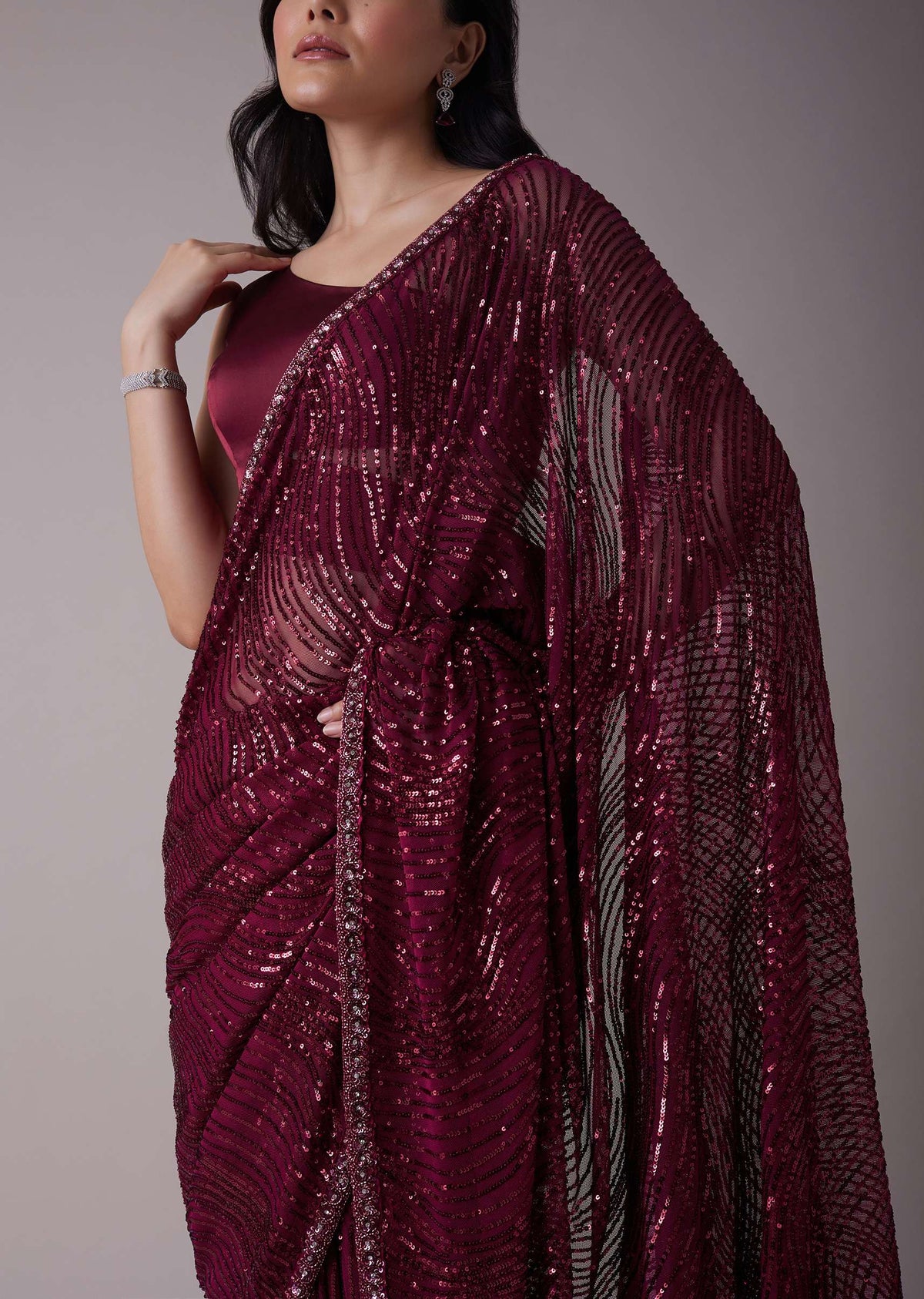 Wine Sequins Saree With An Embellished Border