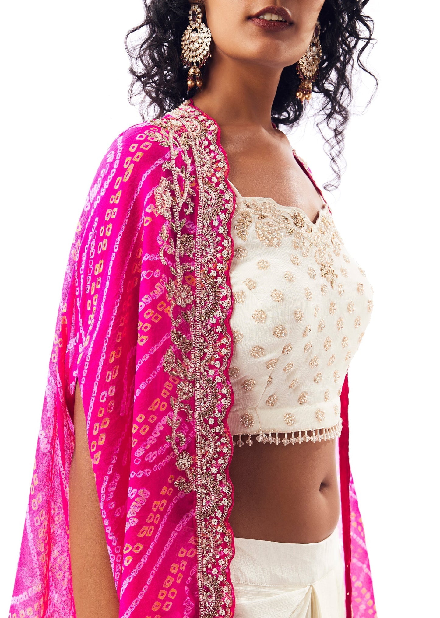 Vibrant Bandhani Festive Couple Set – Bandhani Cape Skirt Set For Her And Pink Silk Tie-Dye Kurta Jacket Set For Him
